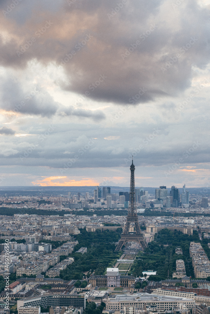 Sunset landscapes of the Paris skyline, view of the Eiffel Tower from the Tour Montparnasse in a cloudy day