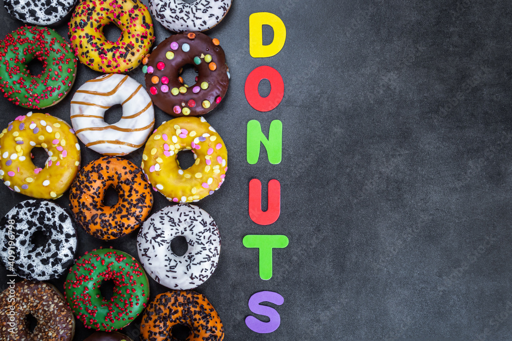 donuts with different flavors of glaze and letters of different colors