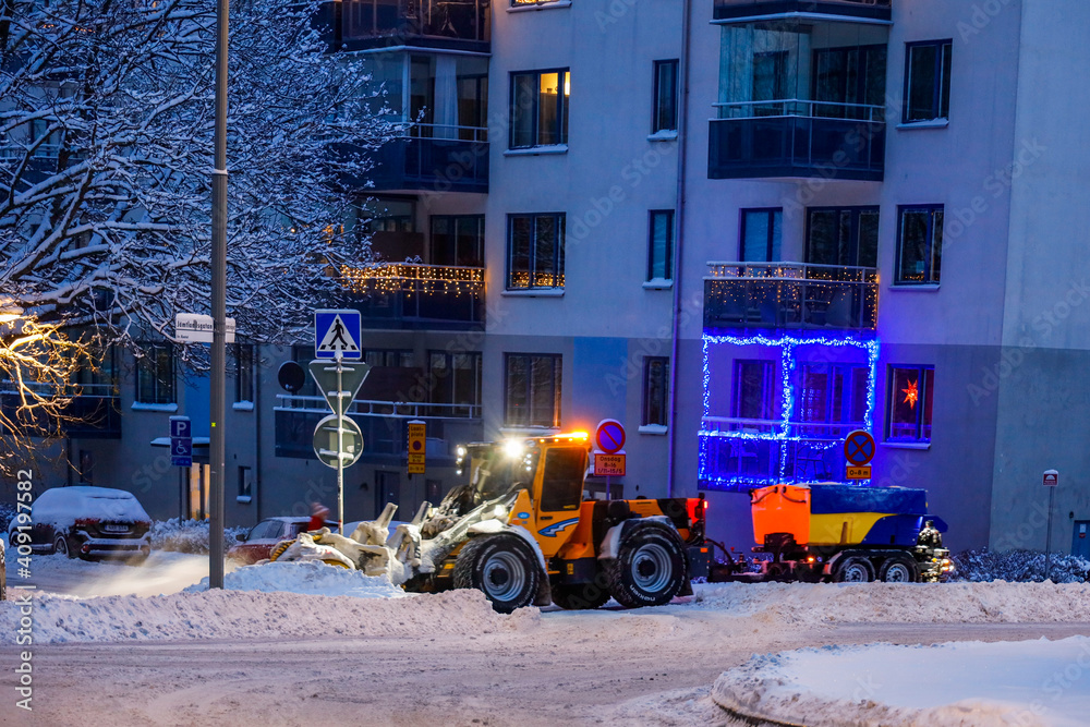 Stockholm, Sweden A snowplow in winter in the Racksta suburb.