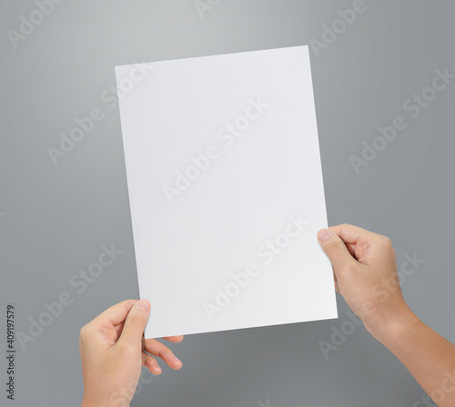 Hands holding paper resume for job application