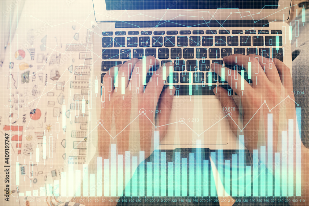 Double exposure of man's hands typing over laptop keyboard and forex chart hologram drawing. Top view. Financial markets concept. Double exposure of man's hands typing over laptop keyboard and forex chart hologram drawing. Top view. Financial markets concept.