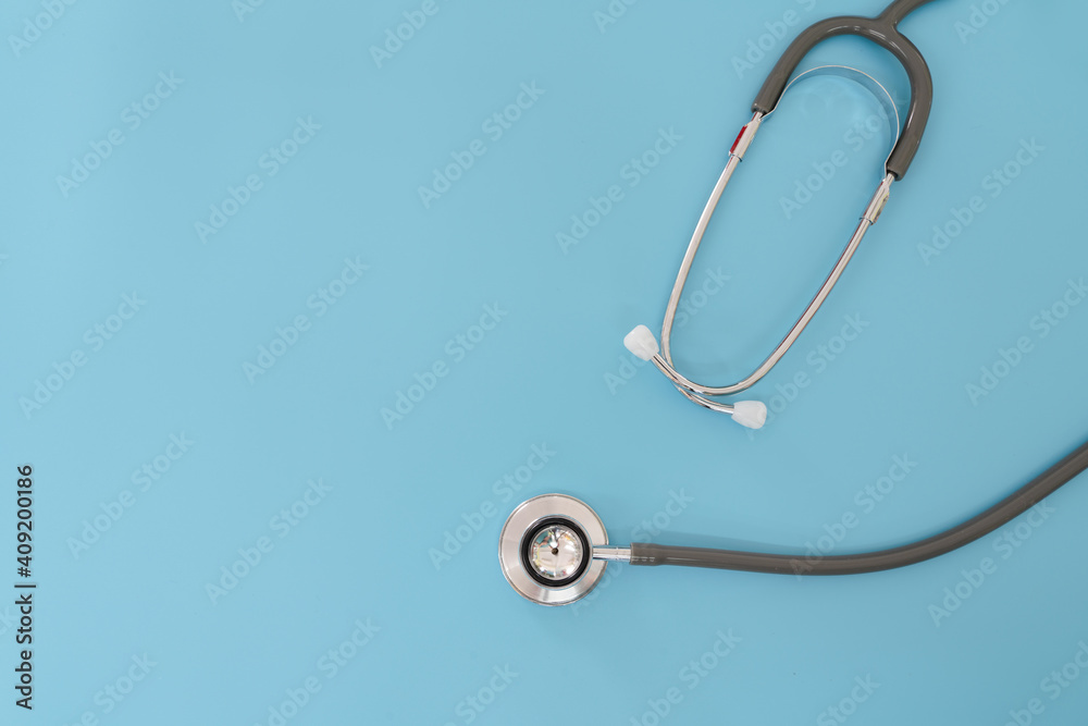 Stethoscope with copy space on blue background. Health and Medical concept. Stethoscope for doctor in a hospital. Stethoscope with copy space on blue background. Health and Medical concept. Stethoscope for doctor in a hospital.
