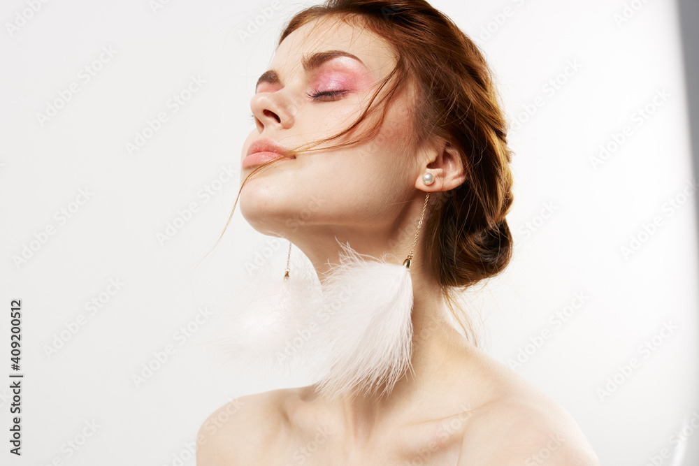 attractive woman bright makeup naked shoulders decoration glamor close-up attractive woman bright makeup naked shoulders decoration glamor close-up