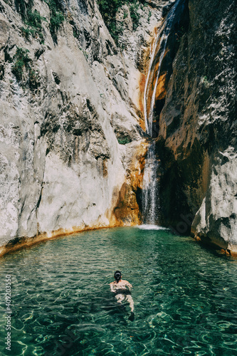 girl in the water in a waterfall in sadernes © zaizev