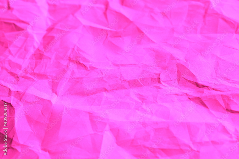 Pink crumpled paper texture background.
