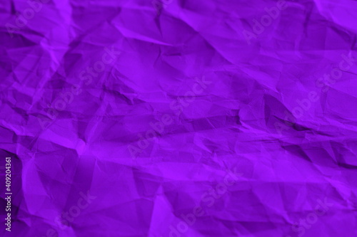 Purple crumpled paper texture background.