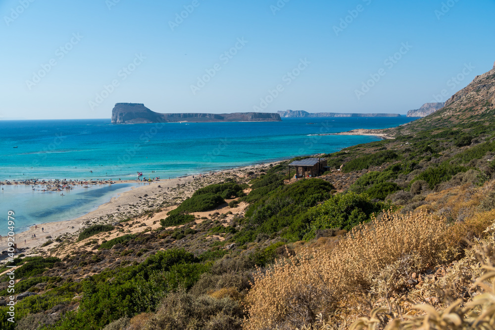 Amazing Panoramic view of Balos Lagoon near Chania, with magical turquoise waters, lagoons, tropical beaches of pure white, pink sand and Gramvousa island on Crete, Cap tigani in the center. Greece