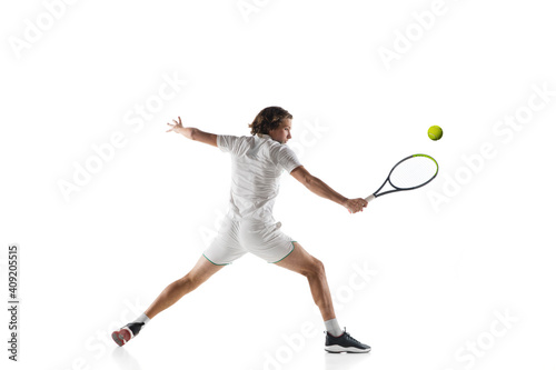 Catching. Young caucasian professional sportsman playing tennis isolated on white background. Training, practicing in motion, action. Power and energy. Movement, ad, sport, healthy lifestyle concept.