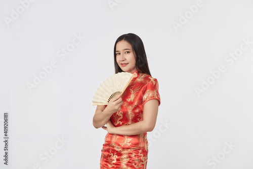 woman red cheongsam dress holding fan photo