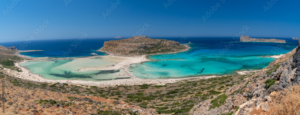Amazing Panoramic view of Balos Lagoon near Chania, with magical turquoise waters, lagoons, tropical beaches of pure white, pink sand and Gramvousa island on Crete, Cap tigani in the center. Greece