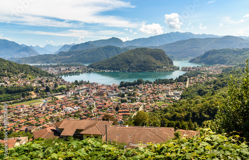 Landscape of lake Lugano and Lavena Ponte Tresa town from Cadegliano Viconago village , province of Varese, Italy photo