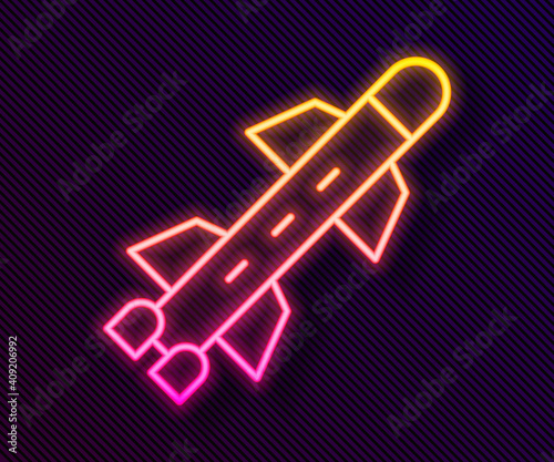 Glowing neon line Rocket icon isolated on black background. Vector.