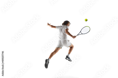 Flying. Young caucasian professional sportsman playing tennis isolated on white background. Training, practicing in motion, action. Power and energy. Movement, ad, sport, healthy lifestyle concept.
