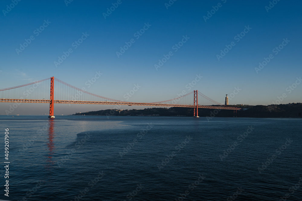 Panorama view over the 25 de Abril Bridge. The bridge is connecting the city of Lisbon to the municipality of Almada on the left bank of the Tejo river, Lisbon