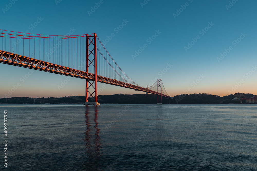 Panorama view over the 25 de Abril Bridge. The bridge is connecting the city of Lisbon to the municipality of Almada on the left bank of the Tejo river, Lisbon