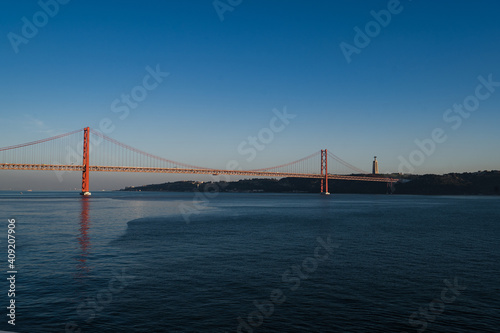 Panorama view over the 25 de Abril Bridge. The bridge is connecting the city of Lisbon to the municipality of Almada on the left bank of the Tejo river, Lisbon © Hoan
