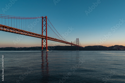 Panorama view over the 25 de Abril Bridge. The bridge is connecting the city of Lisbon to the municipality of Almada on the left bank of the Tejo river, Lisbon © Hoan