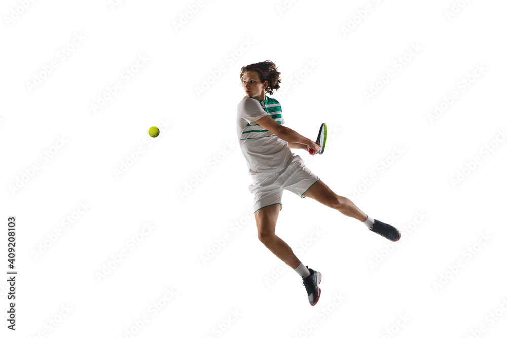 Flying. Young caucasian professional sportsman playing tennis isolated on white background. Training, practicing in motion, action. Power and energy. Movement, ad, sport, healthy lifestyle concept.