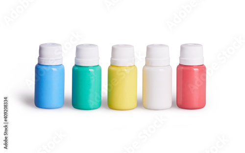 A set of white, red, yellow, green, blue acrylic paints in plastic bottles. Items isolated on a white background with clipping path which does not include shadows 