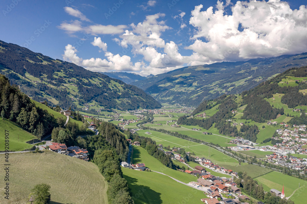 Aerial drone shot of Zillertal valley with clouds in Tyrol Austria summer