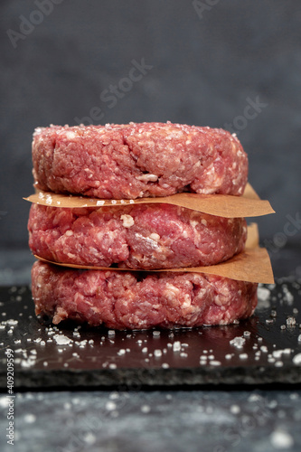 Minced beef meat for burger on black background