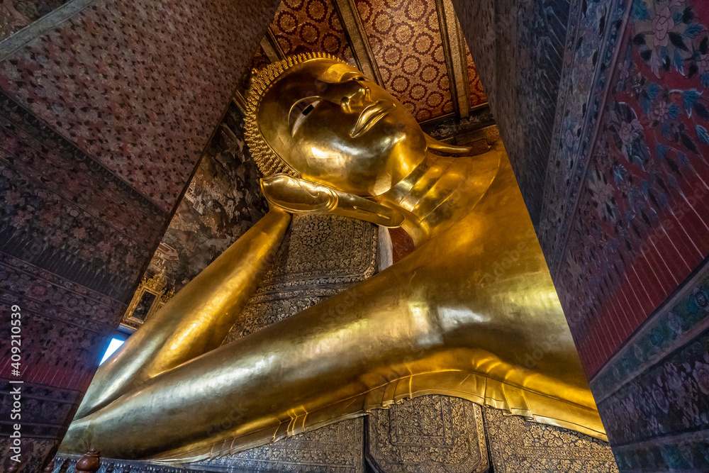 Beautiful thai temple and large golden reclining buddha statue, Wat Pho or Wat Phra Chetuphon is the popular landmark in Bangkok, Thailand