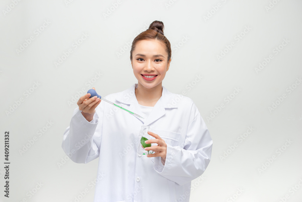 Scientist in uniform holding beaker and test tube have chemical liquid for testing chemical reaction. Scientist in uniform holding beaker and test tube have chemical liquid for testing chemical reaction.