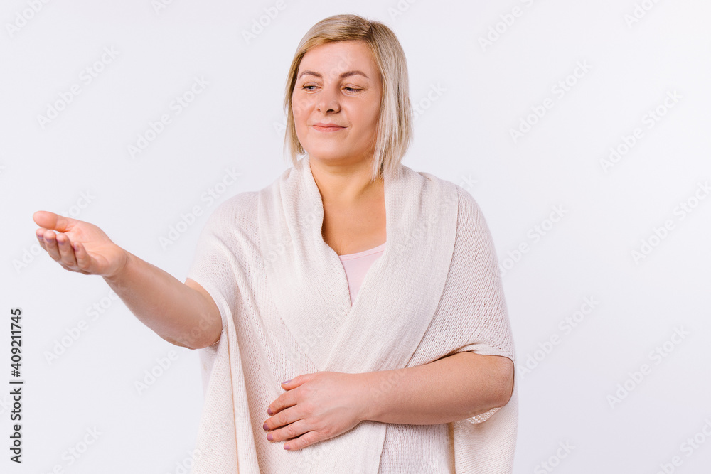 Caucasian cute senior woman with cute stretched out empty palm forward on white background. Caucasian cute senior woman with cute stretched out empty palm forward on white background.