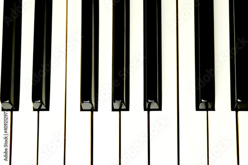 Acoustic piano keys - top angle view - directly above - background - close up