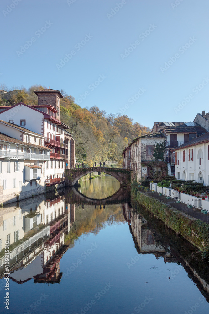 Saint Jean Pied de Port with the Old bridge over the river Nive and the houses along the river in the Basque Country, Spain