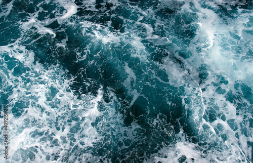 Aerial view to ocean waves. © Alekss