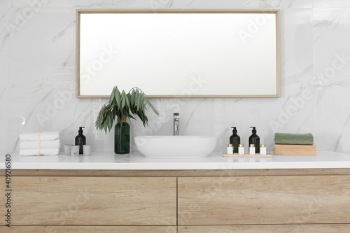 Modern bathroom interior with stylish mirror and vessel sink