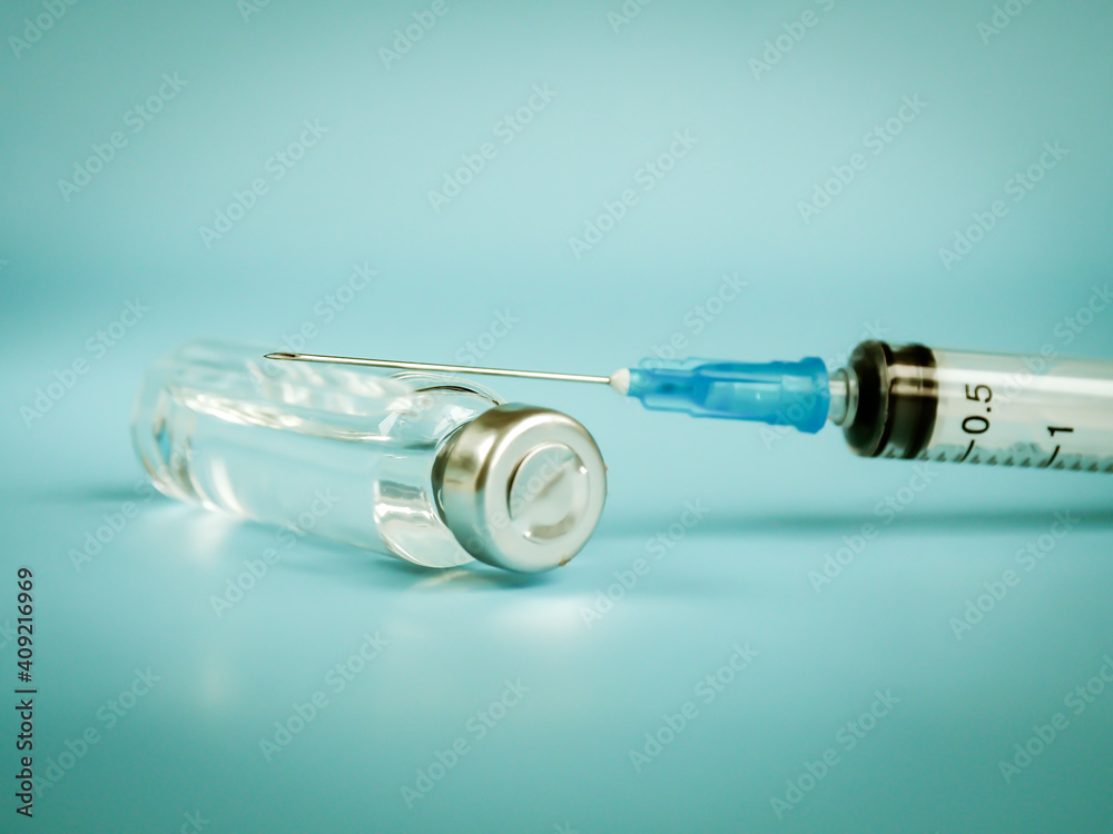 Vaccine and syringe injection. Vials medicine bottles. Laboratory. Prevention,immunization and treatment from corona virus infection COVID-19. Healthcare. Medical concept. Space for text Vaccine and syringe injection. Vials medicine bottles. Laboratory. Prevention,immunization and treatment from corona virus infection COVID-19. Healthcare. Medical concept. Space for text