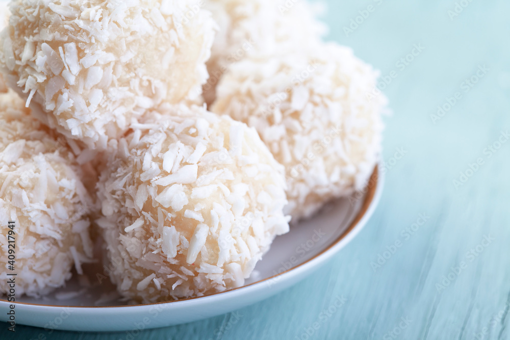 Delicious no-bake sweets, white chocolate truffles topped with grated coconut