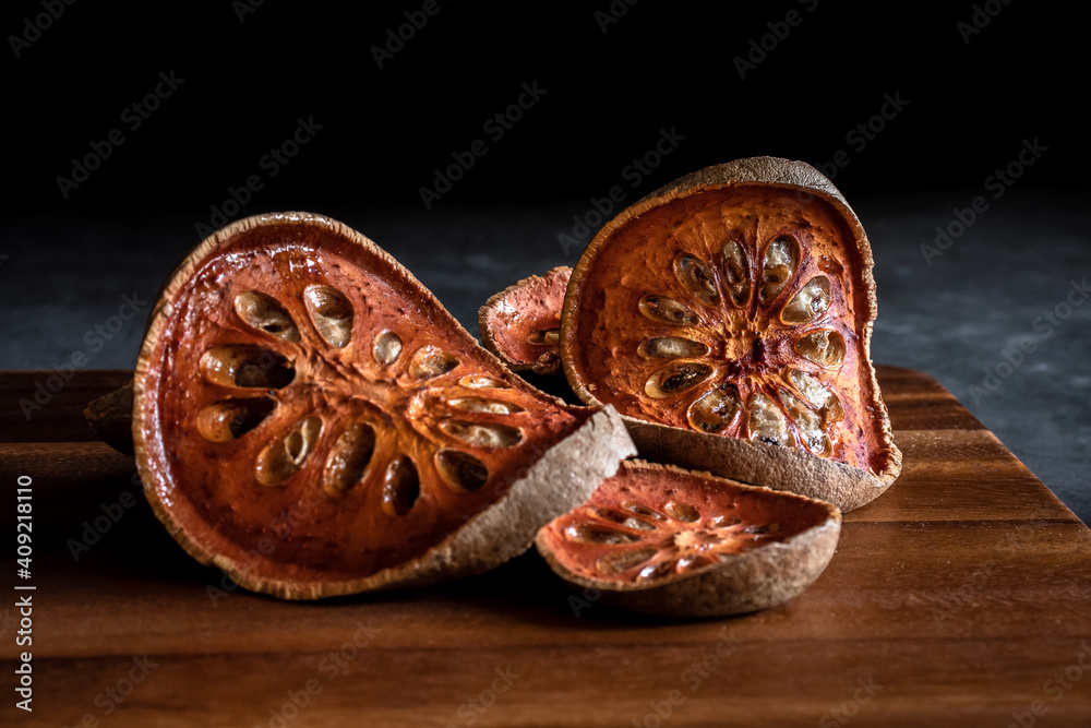 Dried quince on a wooden cutting board Dried quince on a wooden cutting board