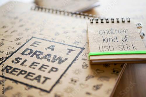 Lots of notebooks on wooden table and top view