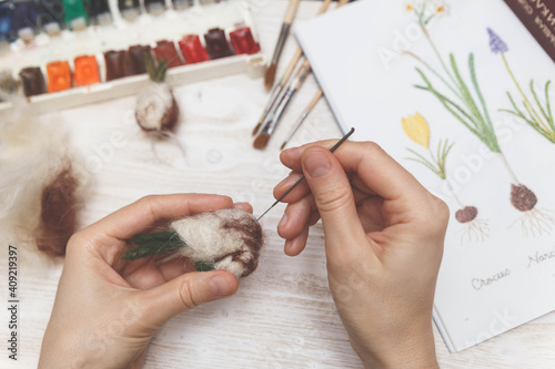 Process of dry felting. Needle felt, wool weaving handmade craft. Inspired by nature. 