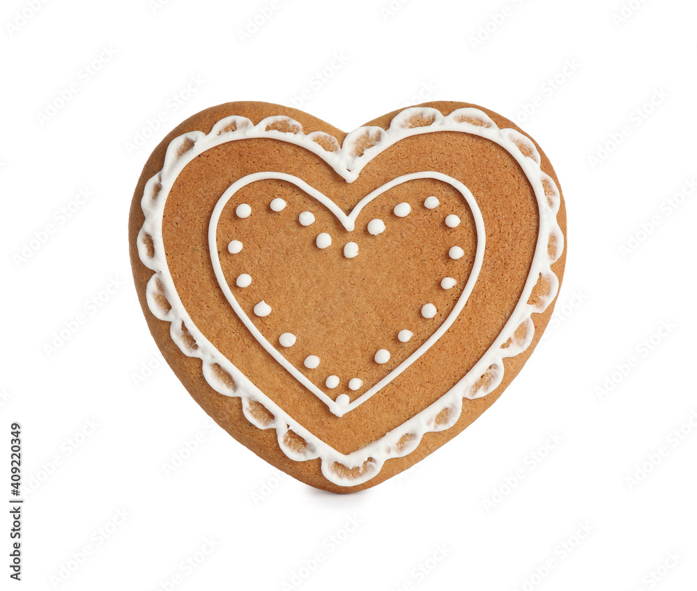 Gingerbread heart decorated with icing isolated on white