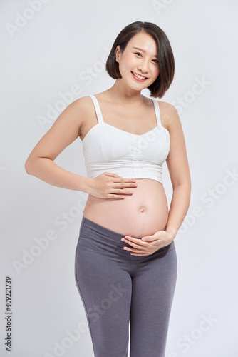 Portrait of the young happy smiling pregnant woman