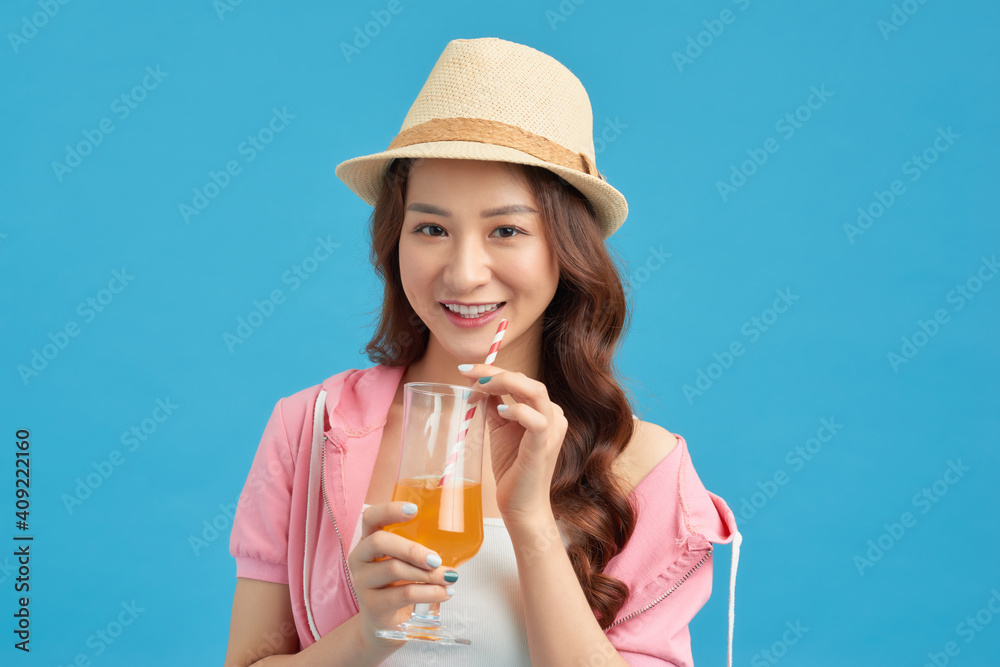 Modern girl drinking orange juice. Isolated portrait. Modern girl drinking orange juice. Isolated portrait.