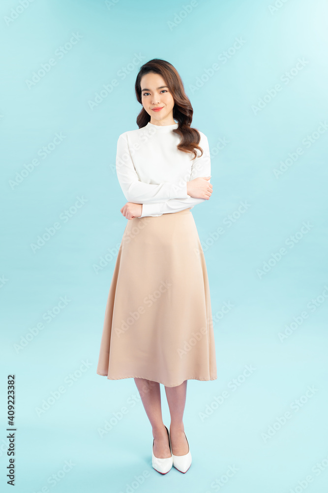 Very happy young woman standing with arms crossed Very happy young woman standing with arms crossed