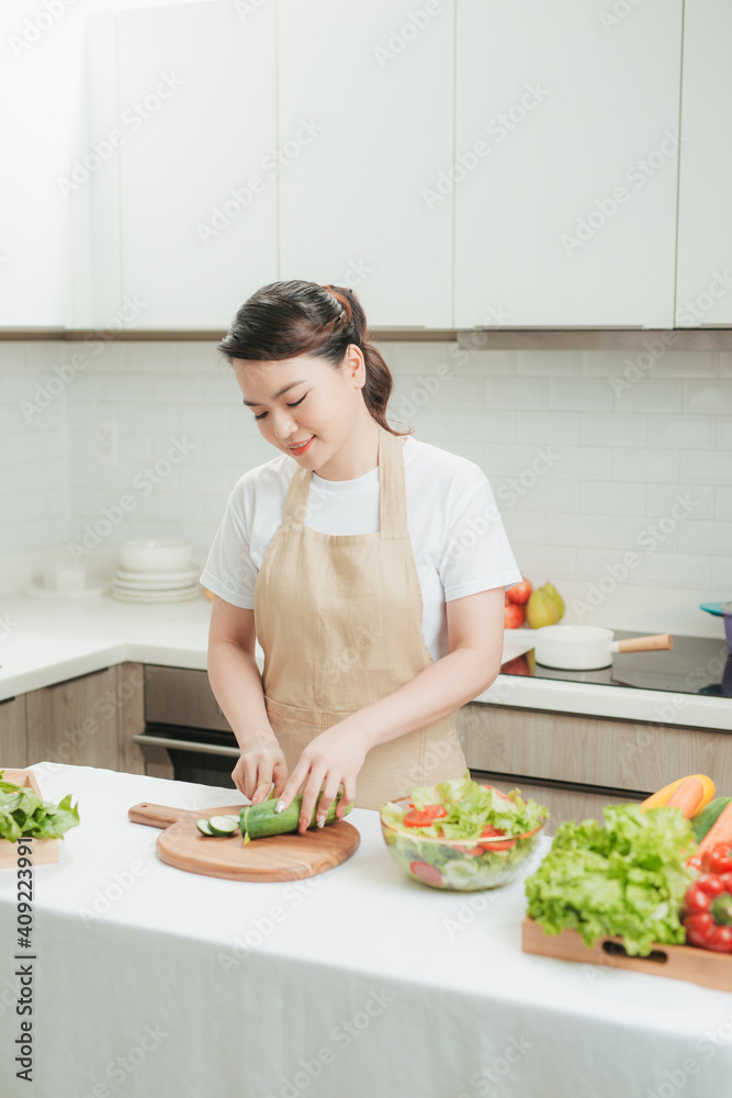 Hands peeling cucumber. Preparation for salad or work.Healthy vegetables Hands peeling cucumber. Preparation for salad or work.Healthy vegetables