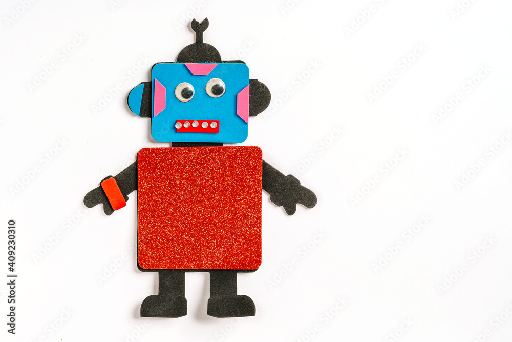 Children's DIY robot made of different colored papers and cardboard Children's DIY robot made of different colored papers and cardboard