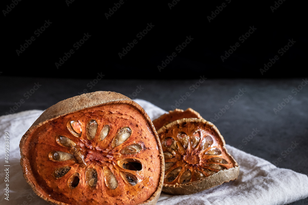 Dried quince on a black marble table Dried quince on a black marble table