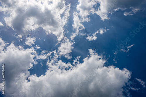 Tableau sur toile Beautiful blue sky with white cumulus clouds (cumulonimbus), bottom view, full frame, photography