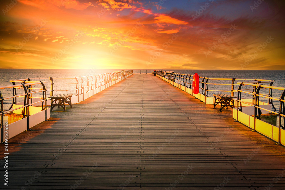 Fototapeta premium Wooden pier at sunset in Saltburn by the Sea, North Yorkshire, UK
