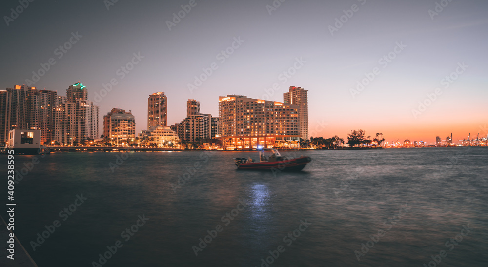 city skyline at sunrise Brickell key Miami Florida boat buildings usa 