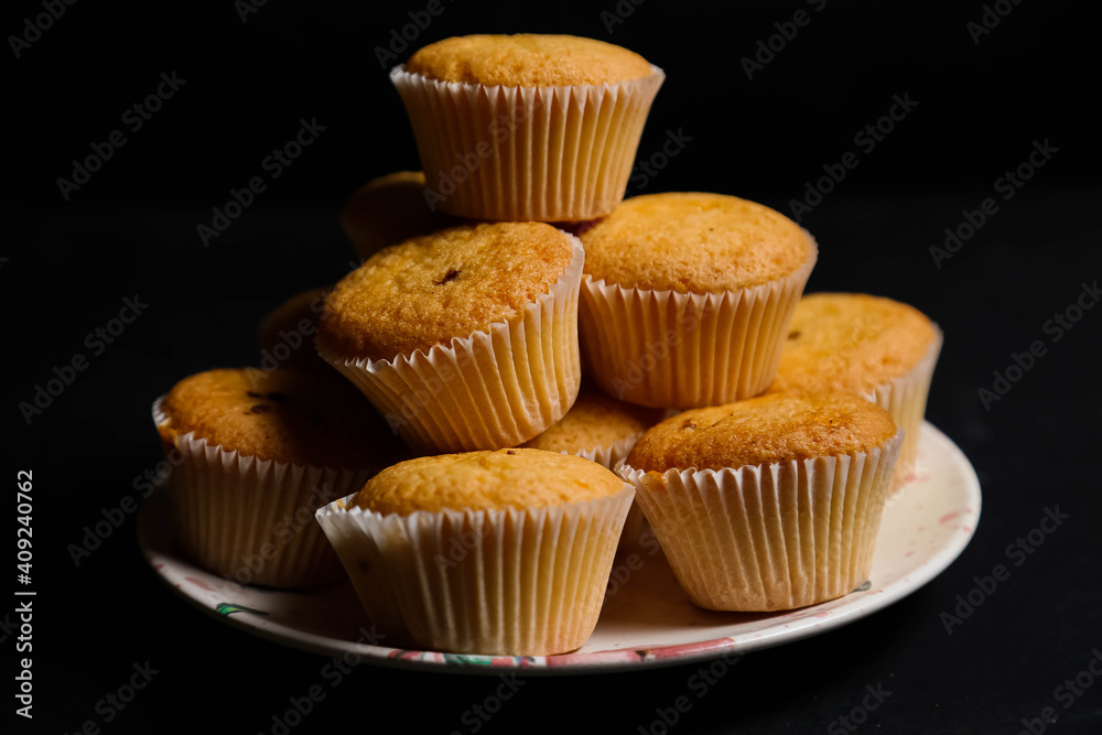 cupcakes on a black background. Baking cupcakes on a black background. Baking