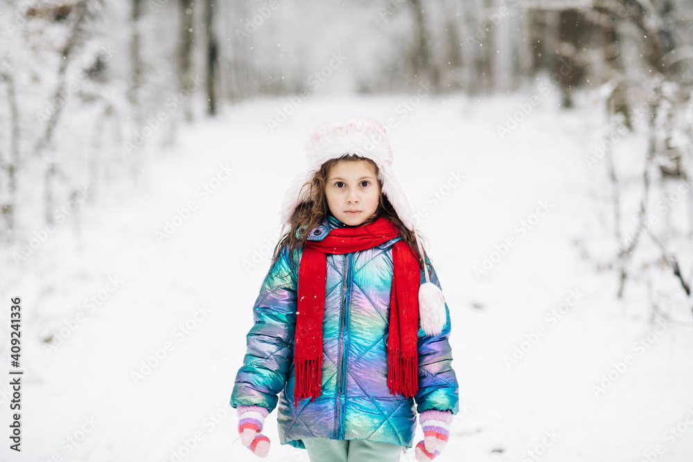 Walk in winter forest. Happy girl plays with a snow in winter day. Girl enjoys winter, frosty day. Winter girl smiling outdoor Walk in winter forest. Happy girl plays with a snow in winter day. Girl enjoys winter, frosty day. Winter girl smiling outdoor