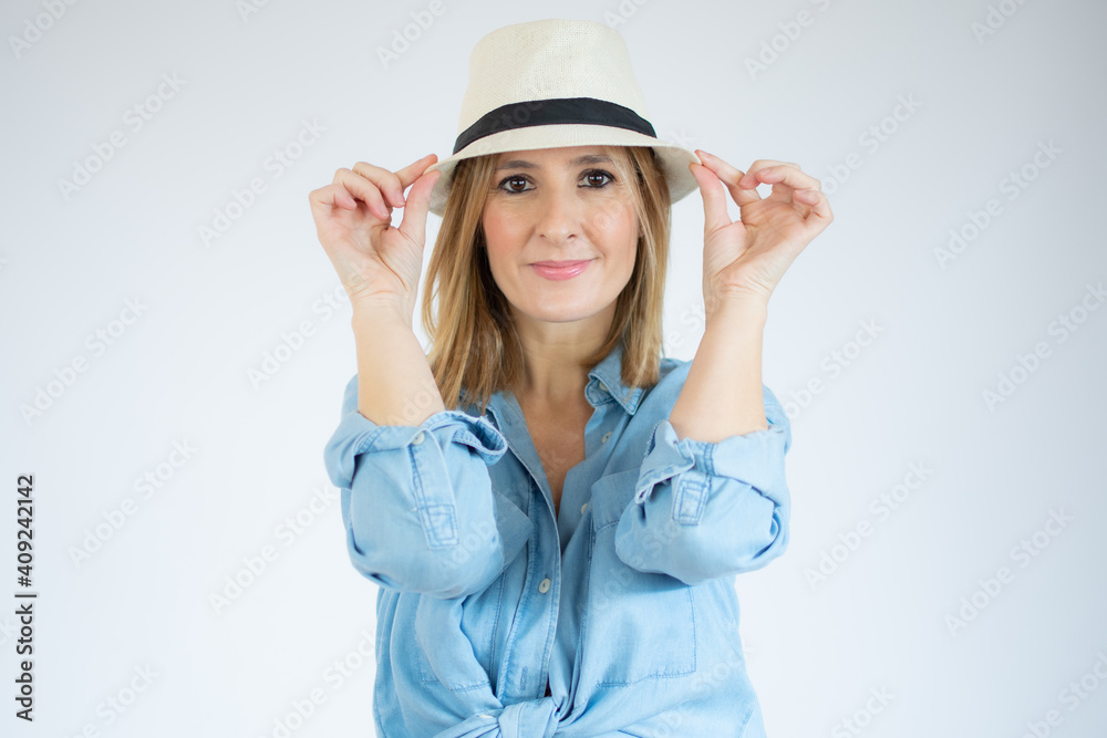 Portrait of gorgeous vacation woman wearing straw hat smiling at camera isolated over white background. Portrait of gorgeous vacation woman wearing straw hat smiling at camera isolated over white background.